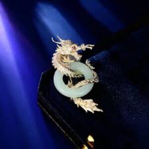 Elegant Gold Dragon Brooch with Jade Accent